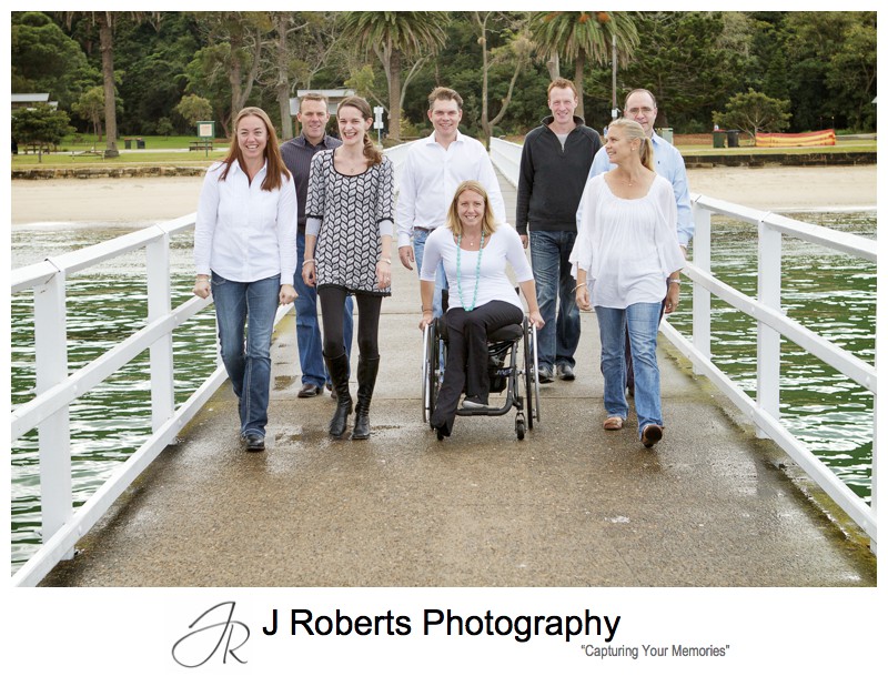 Family group walking along pier - extended family portrait photography sydney